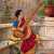 Indian Woman with a Sitar by a Pond in a Garden (by Raja Ravi Varma) Jigsaw Puzzle