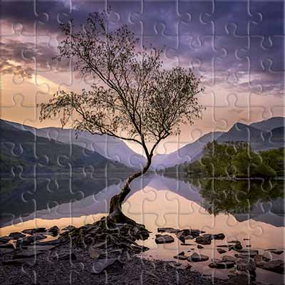 Abendlandschaft mit einem Bergsee Puzzle